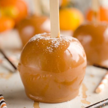 Salted Caramel Apples are fresh tart apples coated in a rich homemade salted caramel for the perfect fall treat!