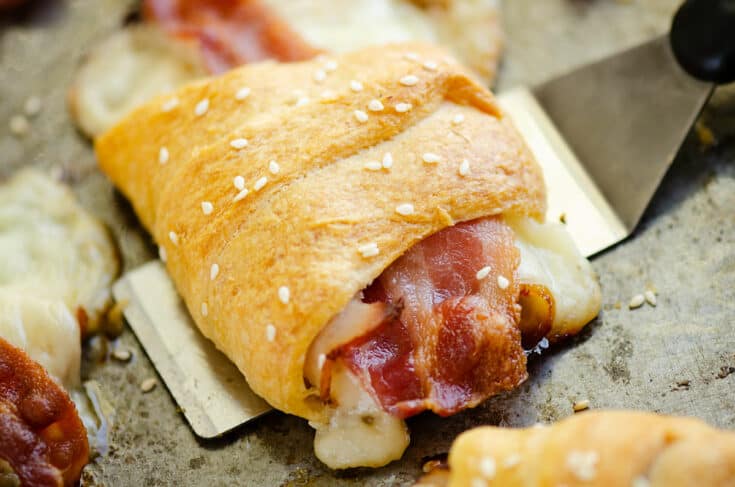 turkey, bacon and swiss cheese wrapped in crescent roll scooped with spatula