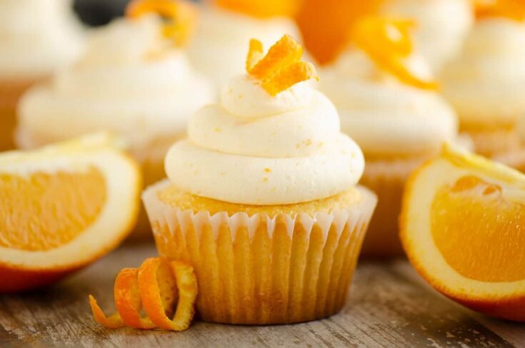 orange cupcakes with orange peel and wedges